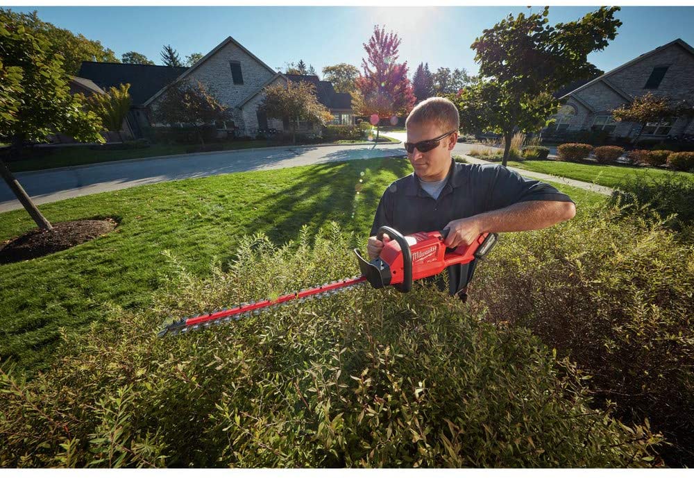 Milwaukee 2726-20 M18 Fuel Hedge Trimmer in action